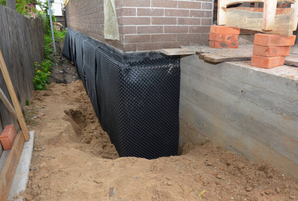 Happy homeowners after waterproofing job in Oconto Falls
